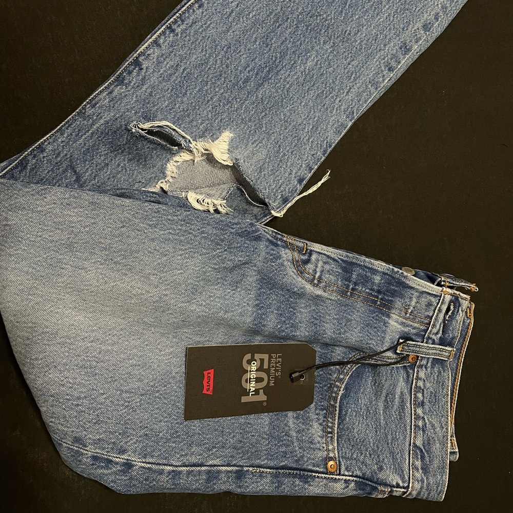 Levi’s 501 Original non-stretch straight leg distressed jeans.